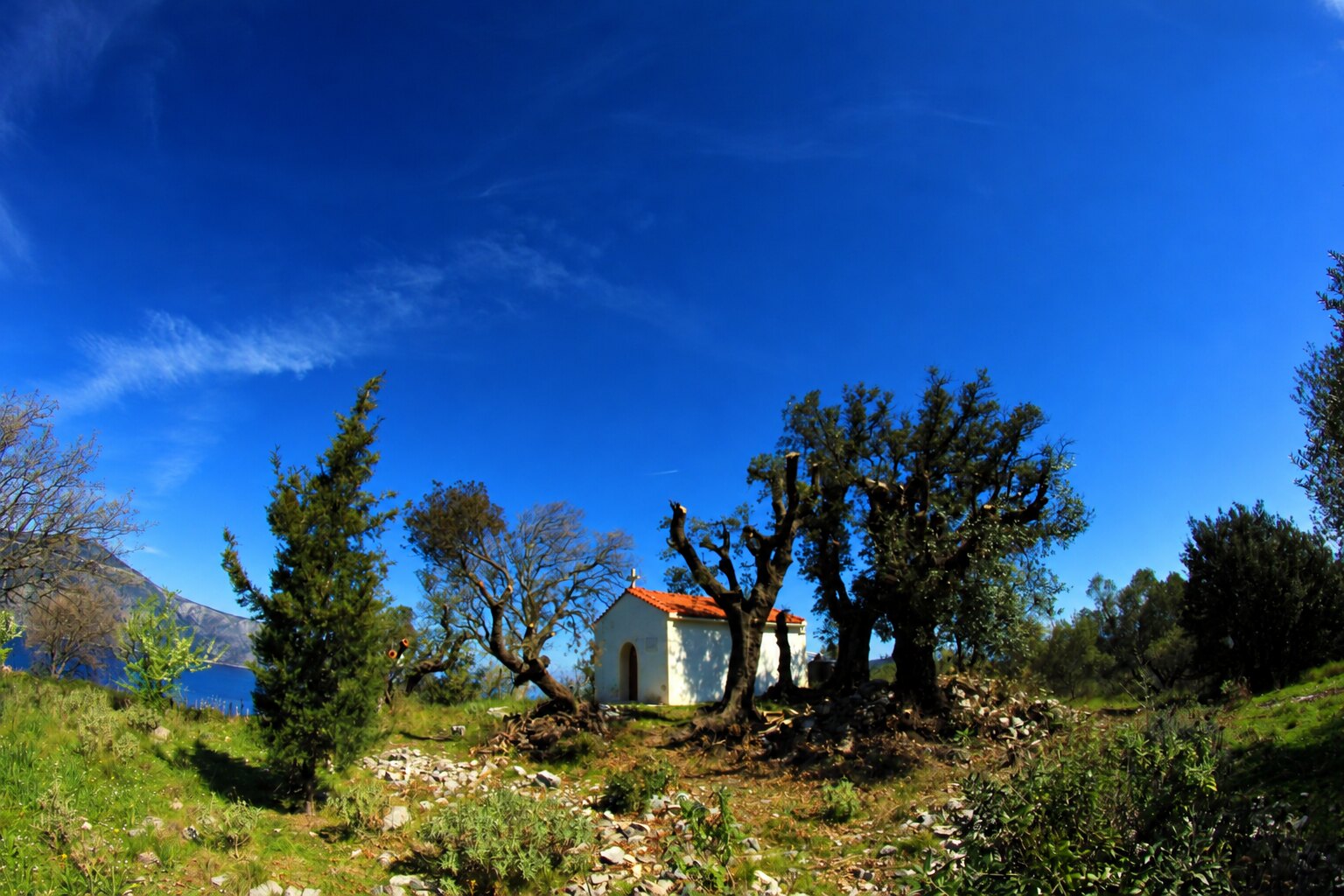 Stone towers on a green hillside